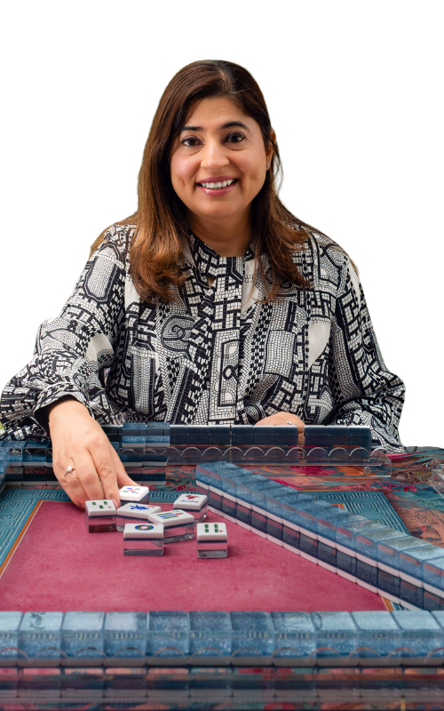 Hashmat Pereira showing a Mahjong tile